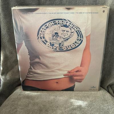 Sale Photo Thumbnail #425: "Keep On Truckin'" by Dave Dudley. 
Here's some information about the album:
Artist: Dave Dudley.
Album Title: Keep On Truckin'.
Release Year: 1973.
Record Label: Mercury Records.
Genre: Primarily Country, especially known for its contribution to "truck-d