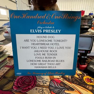 Sale Photo Thumbnail #470: "One Hundred & One Strings Orchestra Play A Tribute To Elvis Presley". 
Here is more information about the album:
Artist: The One Hundred & One Strings Orchestra, also known as the 101 Strings Orchestra, performs the album. The orchestra is a successful e