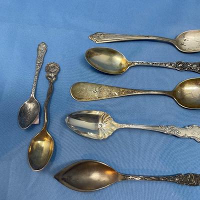 Lot 253 Assorted floral motif Sterling silver spoons & ladle