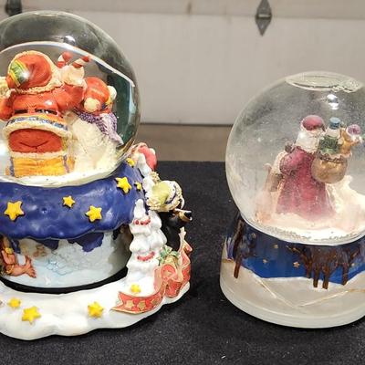 Sale Photo Thumbnail #238: Vintage Snowglobes with Santa & Reindeer " We wish you a Merry Christmas".
Receive both items pictured and are in great condition