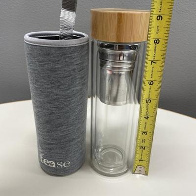 Tease glass bottle in soft case with infuser