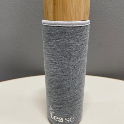 Tease glass bottle in soft case with infuser