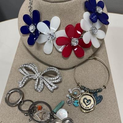 Large bow brooch, floral necklace, bracelet and key chain
