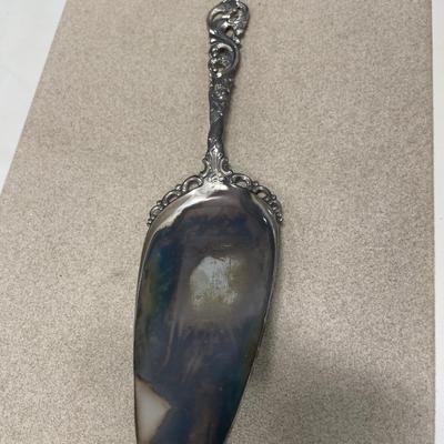 Sterling knife handle, 830 serving spoon and three silver plate items
