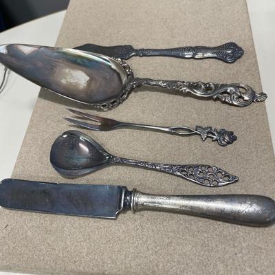 Sterling knife handle, 830 serving spoon and three silver plate items