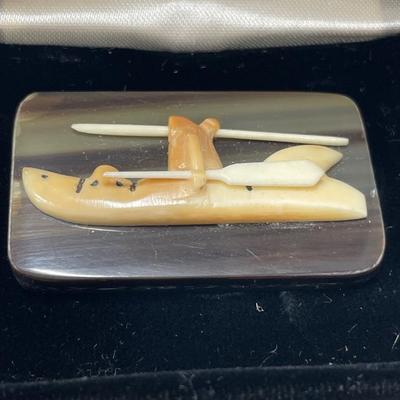 Small boat carving out of bone