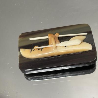Small boat carving out of bone