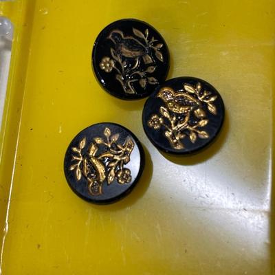 3 small black and gold bird buttons