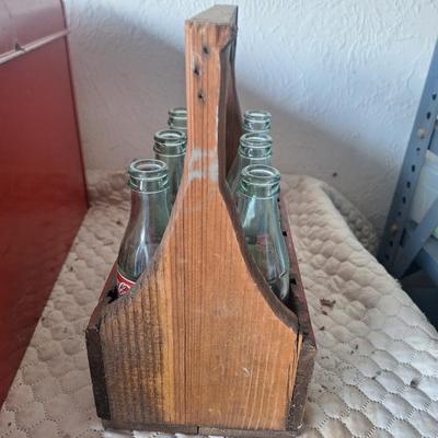Wooden coca cola tray with glass bottles