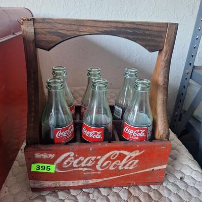 Wooden coca cola tray with glass bottles