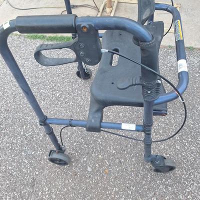 Walker with seat, wheels and brakes