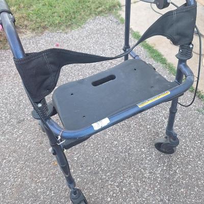 Walker with seat, wheels and brakes