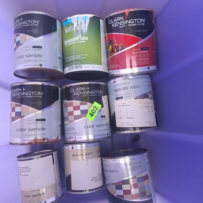 various paint cans feel full or more than half full
