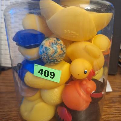 Big plastic jar of rubber ducks