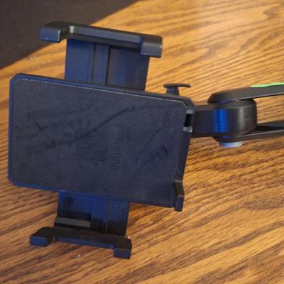 Phone holder that sits in car drink holder, base is adjustable to fit various size cup holders
