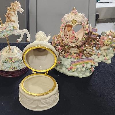 Sale Photo Thumbnail #101: Vintage Resin Rocking Carousel Horse Music Box Sound of Music & Carousel Horse & Carriage Music Box Frank Sinatra. Plus Vintage Angel Jewelry box. 

Will receive all items pictured as in and in great condition.