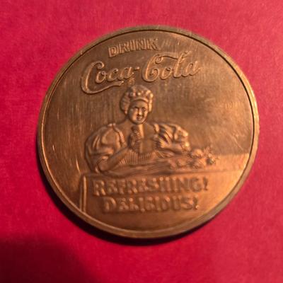 Sale Photo Thumbnail #12: This auction lot is for a Brass Coca-Cola 75th Anniversary in Louisville Commemorative Coin.  It is in used condition but still a very nice addition to your Coca-Cola or local business token collection.