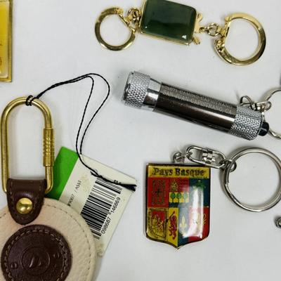 Sale Photo Thumbnail #154: Many different styles of keys and key fobs.  See photos for what's included.