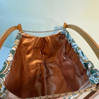 Knit away, MCM Bag and Needles. 