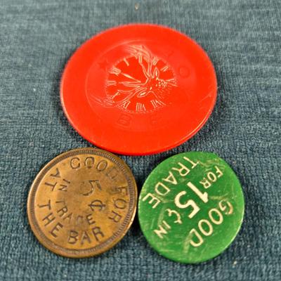 Sale Photo Thumbnail #53: This auction lot is for a Vintage Trio of Louisville Beer Tokens. There are two plastic beer tokens:  BPOE 8 and Bernie's Tim Tam Tavern.  The brass one is for JT's.  All are good for 1 beer.   A bit of Louisville memorabilia for you.  If anyone knows whe