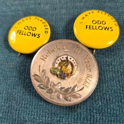 Sale Photo Thumbnail #55: This auction lot is for some Odd Fellows Collectibles. This includes 2 Odd Fellows pledge pins and one nice stainless "Rebekah of the Year" 1978 Pin.  It was given to Mable Mitchell.  What a nice collection.
