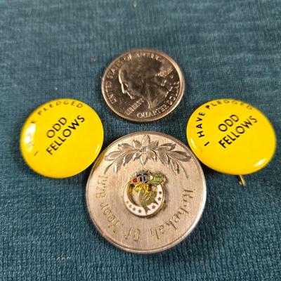 Sale Photo Thumbnail #57: This auction lot is for some Odd Fellows Collectibles. This includes 2 Odd Fellows pledge pins and one nice stainless "Rebekah of the Year" 1978 Pin.  It was given to Mable Mitchell.  What a nice collection.