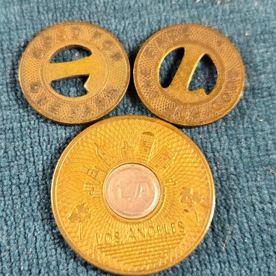 Sale Photo Thumbnail #58: This auction lot is for some Vintage Transit Tokens. The large one is from Los Angeles, CA and the other two are older styled tokens for Louisville, KY.  They are all metal - brass, used condition.  They are a neat collectible for sure.