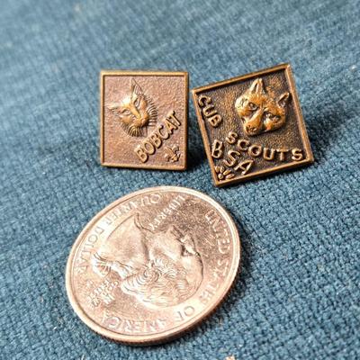 Sale Photo Thumbnail #69: This auction lot is for Cub Scout Lapel Pins. This is a vintage set of Cub Scout Pins.  The Bob Cat is the first level of Cub Scouting.  They are in very good condition, however one is missing the clamp holder for the pin.