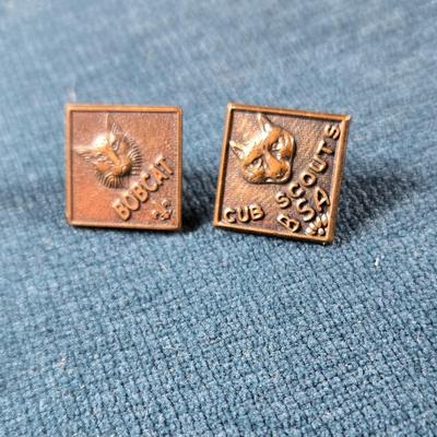 Sale Photo Thumbnail #67: This auction lot is for Cub Scout Lapel Pins. This is a vintage set of Cub Scout Pins.  The Bob Cat is the first level of Cub Scouting.  They are in very good condition, however one is missing the clamp holder for the pin.