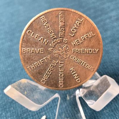 Sale Photo Thumbnail #70: This auction lot is for a Boy Scout Oath Challenge Coin. This is a vintage Boy Scout Oath Coin.  It is a large brass coin that is about 1.5-inches in diameter.  It is in good used condition.  This is a great scouting collectible.