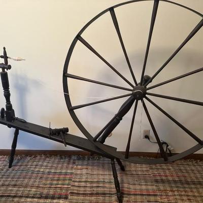 Sale Photo Thumbnail #104: Beautiful vintage spinning wheel in good shape. The wheel is 40 inches in diameter. All spikes in and good shape
The length of the spinning wheel is approximately 65 inches .