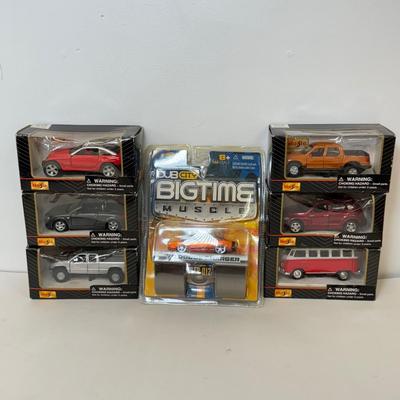 LOT 102: Collection of Maisto Car Models in Package & More