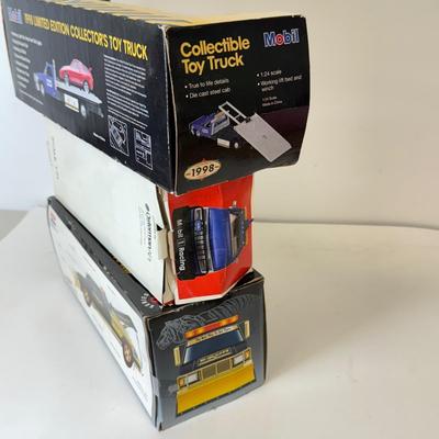 LOT 108: Exxon Diesel Cast Tanker Truck, Lukoil Corvette Carrier, 1999 Mobil LE Collector Toy Truck & More