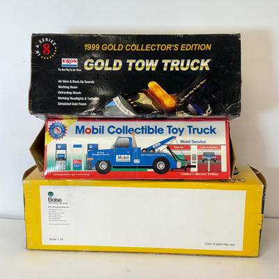 LOT 108: Exxon Diesel Cast Tanker Truck, Lukoil Corvette Carrier, 1999 Mobil LE Collector Toy Truck & More