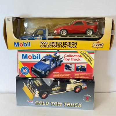 LOT 108: Exxon Diesel Cast Tanker Truck, Lukoil Corvette Carrier, 1999 Mobil LE Collector Toy Truck & More