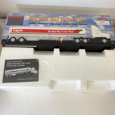 LOT 108: Exxon Diesel Cast Tanker Truck, Lukoil Corvette Carrier, 1999 Mobil LE Collector Toy Truck & More
