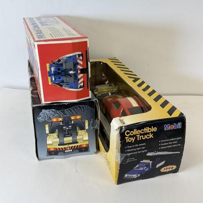 LOT 108: Exxon Diesel Cast Tanker Truck, Lukoil Corvette Carrier, 1999 Mobil LE Collector Toy Truck & More