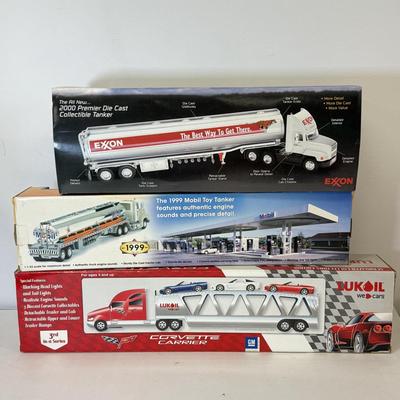 LOT 108: Exxon Diesel Cast Tanker Truck, Lukoil Corvette Carrier, 1999 Mobil LE Collector Toy Truck & More