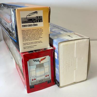 LOT 108: Exxon Diesel Cast Tanker Truck, Lukoil Corvette Carrier, 1999 Mobil LE Collector Toy Truck & More