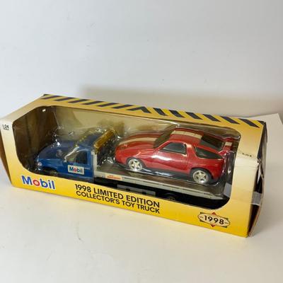 LOT 108: Exxon Diesel Cast Tanker Truck, Lukoil Corvette Carrier, 1999 Mobil LE Collector Toy Truck & More
