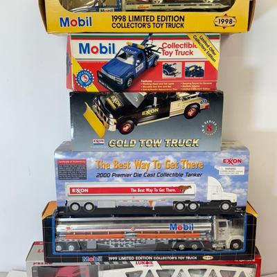 LOT 108: Exxon Diesel Cast Tanker Truck, Lukoil Corvette Carrier, 1999 Mobil LE Collector Toy Truck & More