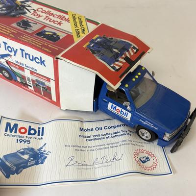 LOT 108: Exxon Diesel Cast Tanker Truck, Lukoil Corvette Carrier, 1999 Mobil LE Collector Toy Truck & More