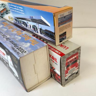 LOT 108: Exxon Diesel Cast Tanker Truck, Lukoil Corvette Carrier, 1999 Mobil LE Collector Toy Truck & More