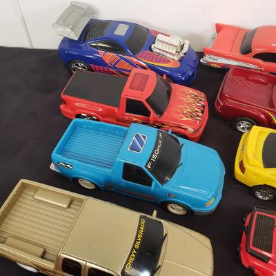 LOT 141: Large Assortment of Plastic Cars & Trucks- Vintage Nascar Racers 808 Flyer, Hot Wheels Flamethrower & More