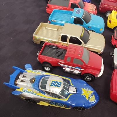 LOT 141: Large Assortment of Plastic Cars & Trucks- Vintage Nascar Racers 808 Flyer, Hot Wheels Flamethrower & More