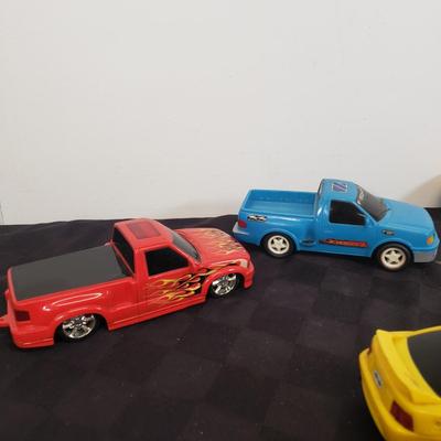 LOT 141: Large Assortment of Plastic Cars & Trucks- Vintage Nascar Racers 808 Flyer, Hot Wheels Flamethrower & More