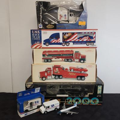 LOT 144: Taylor Trucks Christmas Sears Trucks, USA Racing Team, Peterbilt Long Hauler, 1:18 Scale Limousine & More