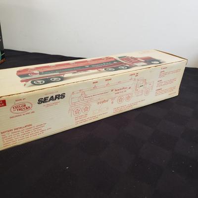 LOT 144: Taylor Trucks Christmas Sears Trucks, USA Racing Team, Peterbilt Long Hauler, 1:18 Scale Limousine & More