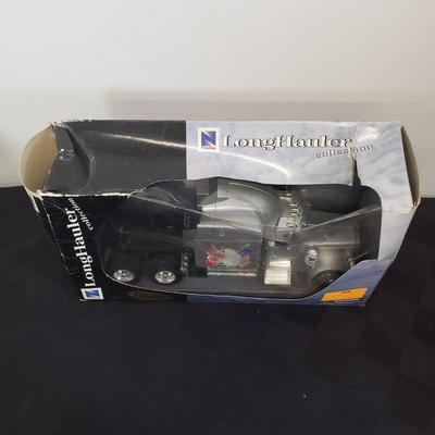 LOT 144: Taylor Trucks Christmas Sears Trucks, USA Racing Team, Peterbilt Long Hauler, 1:18 Scale Limousine & More