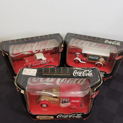 LOT 146: Coca Cola Collectibles-Matchbox New in Package & Toy Truck with Conveyor Belt & Mini Coke Bottles